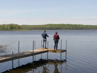 Fishing off the end of the dock at The Cottage on Big Sand Lake